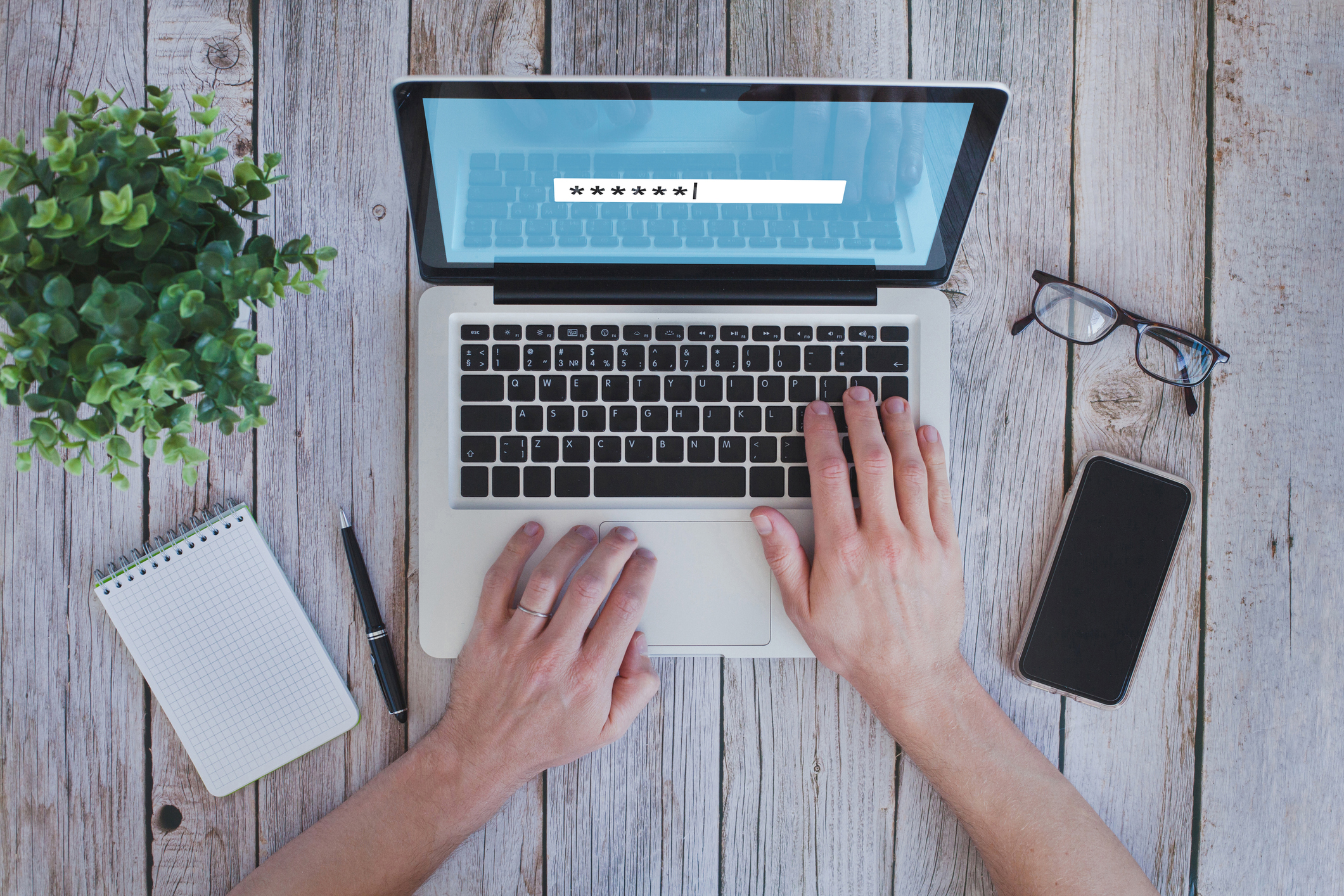 user typing password on computer, security code.